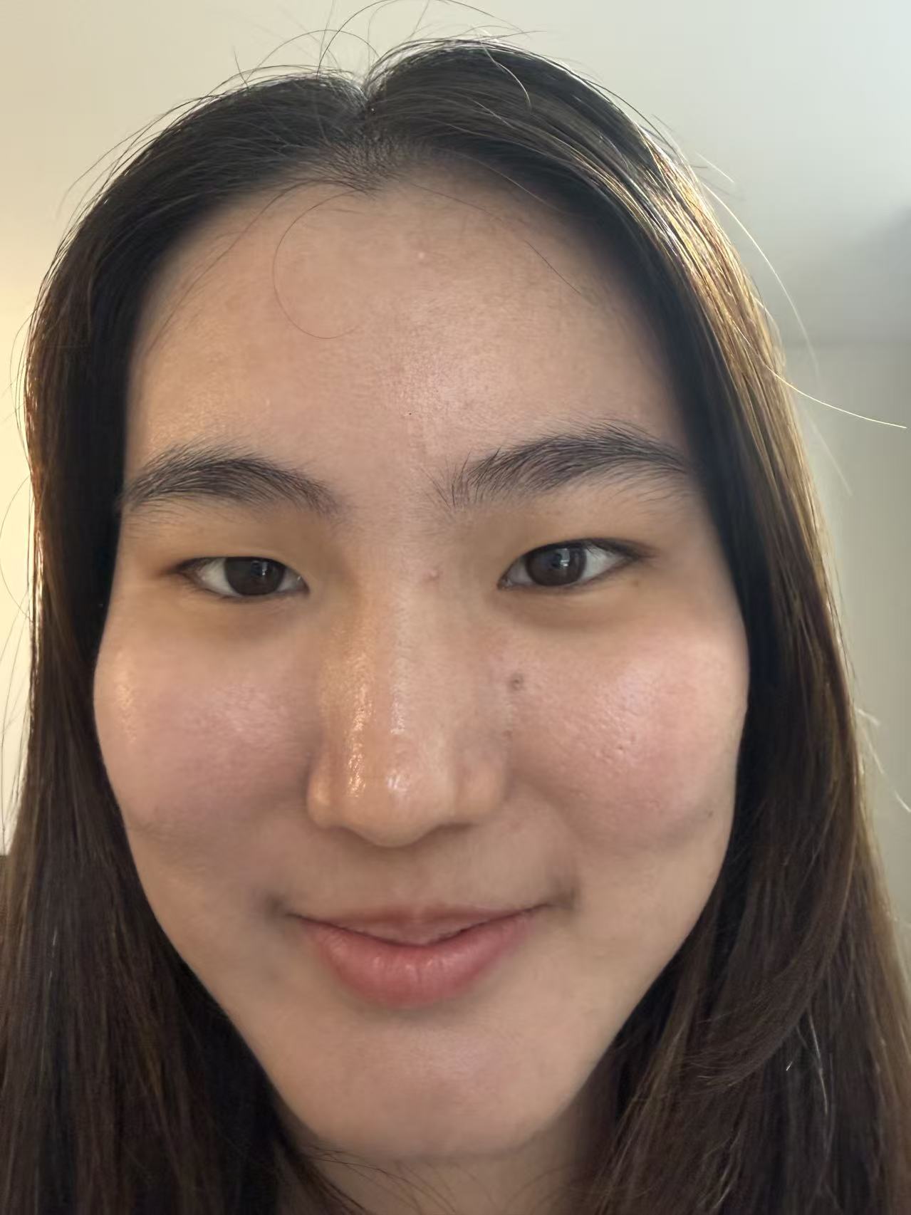 Close-up selfie taken from a short distance, showing typical wide-angle facial distortion